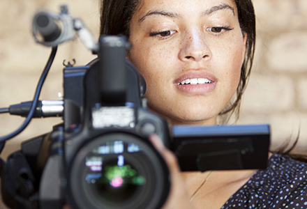 woman holding a video camera