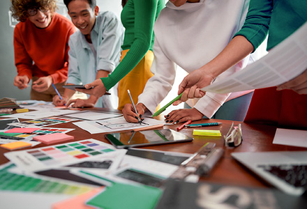 Team of creatives working on a mood board together