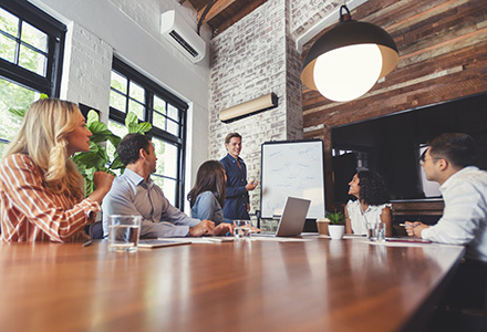 Group of professionals around a conference table in a planning session