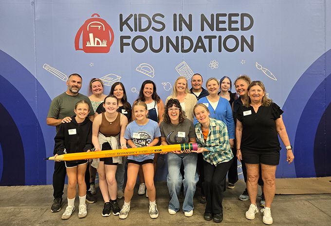Group shot of event attendees at Kids In Need Foundation