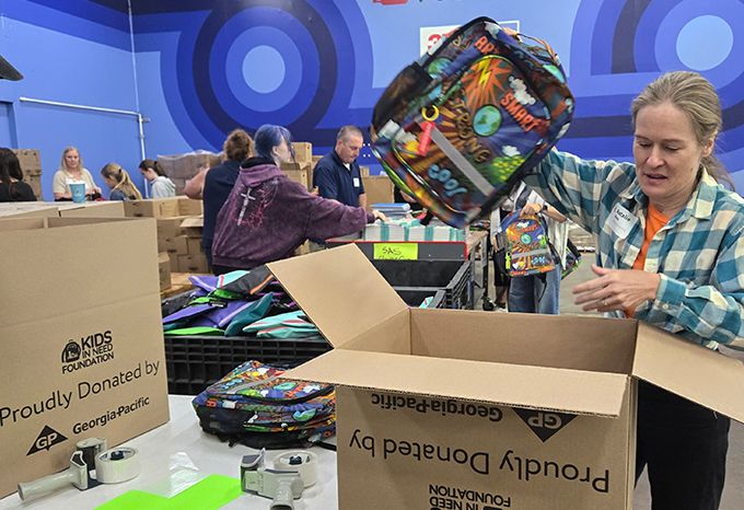 Packing backpacks at Kids In Need Foundation