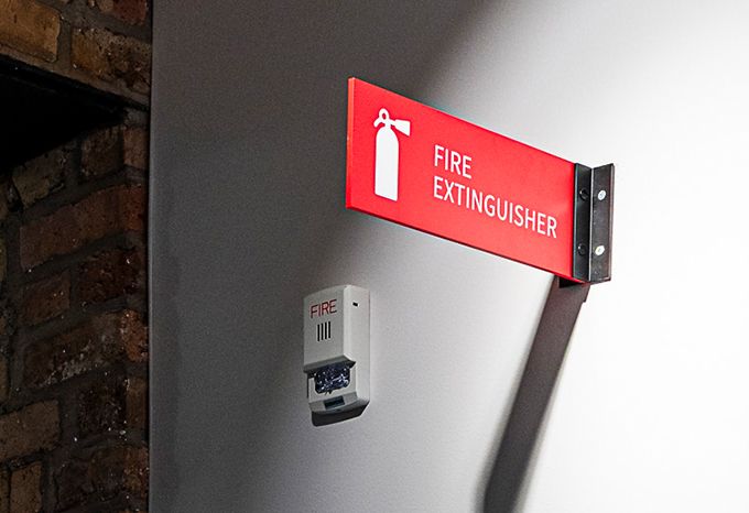 Fire extinguisher sign for McKnight Foundation