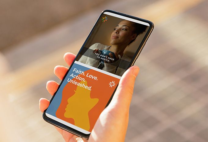 Person holding phone with social media graphics with the headlines: You don't need to hustle and Faith. Love. Action. Unleashed.